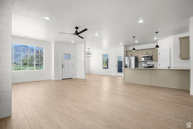 1631 W Century Ln Unit A, Mapleton, UT 84664 - unfurnished living room featuring recessed lighting, ceiling fan, light wood-style floors, baseboards, and a textured ceiling