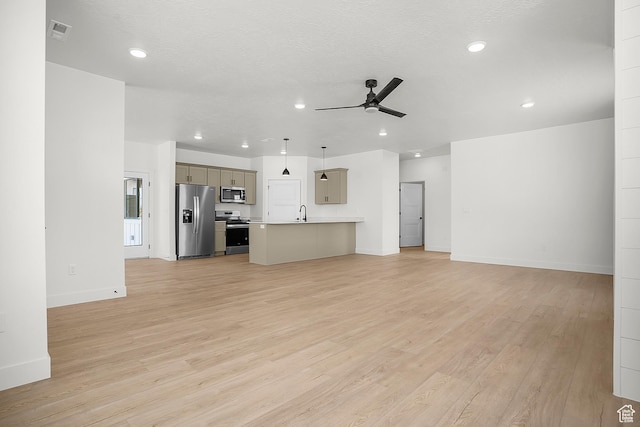1631 W Century Ln Unit A, Mapleton, UT 84664 - unfurnished living room featuring ceiling fan, light wood-style floors, recessed lighting, baseboards, and a sink
