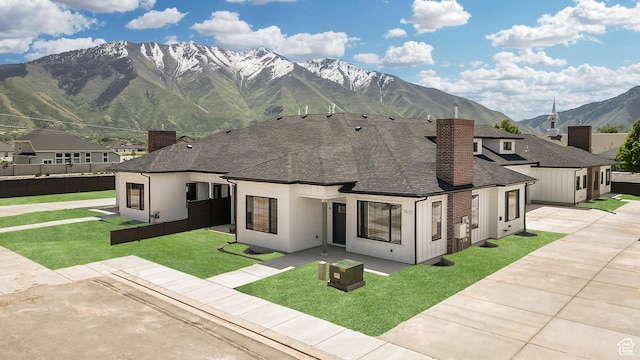 1631 W Century Ln Unit A, Mapleton, UT 84664 - view of front facade featuring a chimney, a shingled roof, a mountain view, and stucco siding