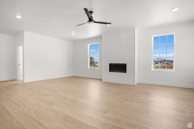1631 W Century Ln Unit A, Mapleton, UT 84664 - unfurnished living room featuring ceiling fan, light wood-style flooring, healthy amount of natural light, and recessed lighting