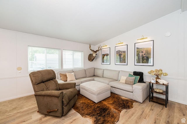 1935 S 1250 W, Logan, UT 84321 - living area featuring vaulted ceiling, light wood-style floors, and a decorative wall