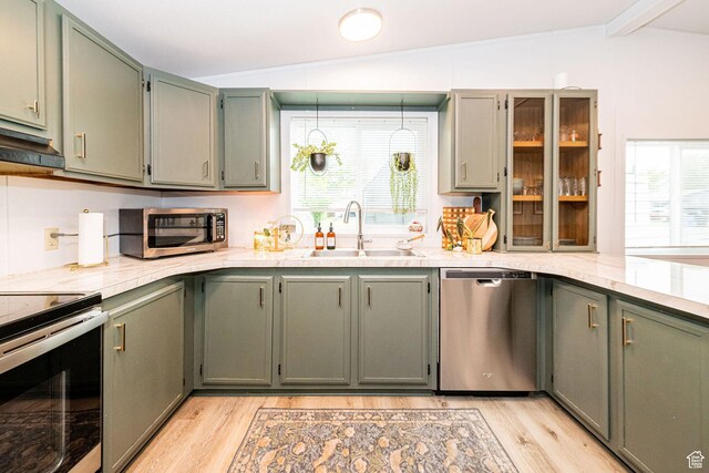 1935 S 1250 W, Logan, UT 84321 - kitchen with stainless steel appliances, a sink, light wood-style flooring, under cabinet range hood, and plenty of natural light