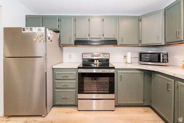 1935 S 1250 W, Logan, UT 84321 - kitchen with stainless steel appliances, extractor fan, light countertops, and light wood-style flooring