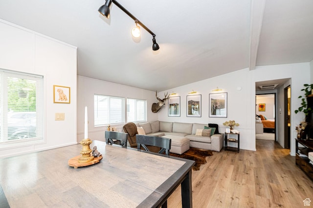 1935 S 1250 W, Logan, UT 84321 - dining area with light wood-type flooring, healthy amount of natural light, and beamed ceiling