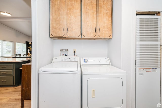 1935 S 1250 W, Logan, UT 84321 - laundry area featuring a heating unit, cabinet space, washing machine and dryer, and light wood-style floors