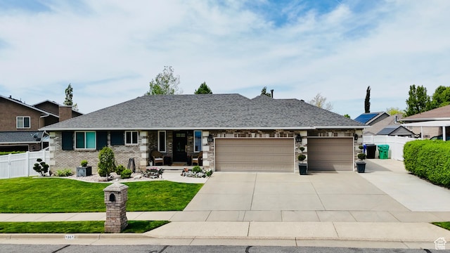 1367 N Brookhurst Cir, Centerville, UT 84014 - view of front facade featuring a garage, concrete driveway, and brick siding