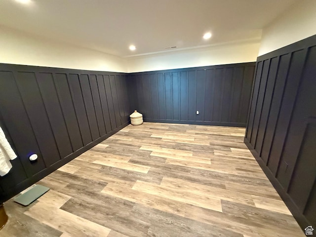 1367 N Brookhurst Cir, Centerville, UT 84014 - spare room featuring a wainscoted wall and light wood-style flooring