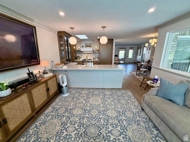 1367 N Brookhurst Cir, Centerville, UT 84014 - kitchen featuring a peninsula, open floor plan, wood finished floors, hanging light fixtures, and recessed lighting