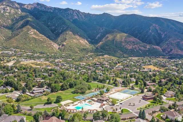 aerial view of a pool and a mountain backdrop