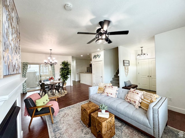 5062 W Valmont Way, Herriman, UT 84096 - living room featuring a chandelier, wood finished floors, baseboards, stairway, and a ceiling fan