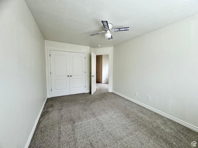 5062 W Valmont Way, Herriman, UT 84096 - unfurnished bedroom featuring carpet flooring, baseboards, a closet, ceiling fan, and a textured ceiling