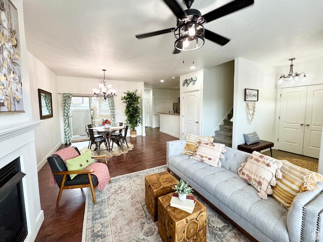 5062 W Valmont Way, Herriman, UT 84096 - living room with a chandelier, baseboards, wood finished floors, a fireplace, and stairway