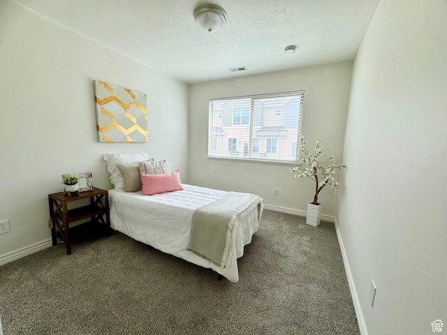 5062 W Valmont Way, Herriman, UT 84096 - bedroom with baseboards, dark colored carpet, and a textured ceiling