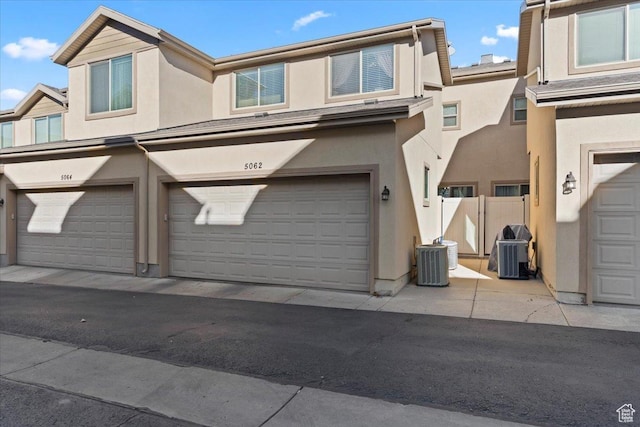 5062 W Valmont Way, Herriman, UT 84096 - view of front of home featuring stucco siding and central air condition unit