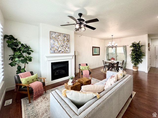 5062 W Valmont Way, Herriman, UT 84096 - living room with a fireplace, a chandelier, baseboards, wood finished floors, and a textured ceiling