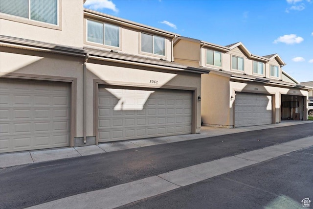 5062 W Valmont Way, Herriman, UT 84096 - view of front of house with stucco siding and an attached garage