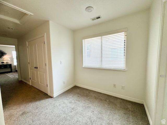 5062 W Valmont Way, Herriman, UT 84096 - unfurnished bedroom with carpet floors, baseboards, and attic access