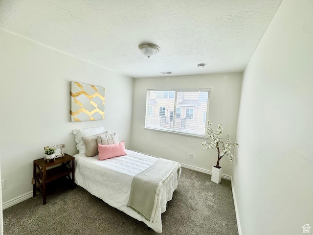 5062 W Valmont Way, Herriman, UT 84096 - bedroom with dark colored carpet, baseboards, and a textured ceiling