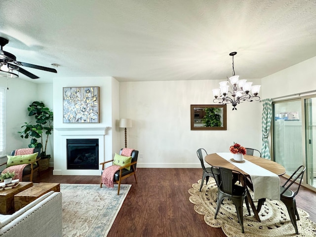 5062 W Valmont Way, Herriman, UT 84096 - dining area with a fireplace, a chandelier, baseboards, wood finished floors, and a textured ceiling