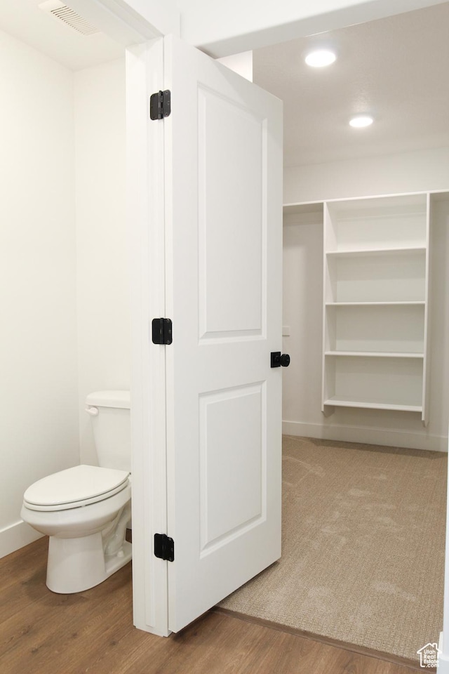 757 E 1250 S, Hyrum, UT 84319 - bathroom featuring wood finished floors, toilet, recessed lighting, and baseboards