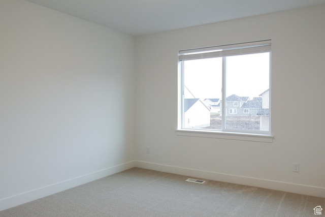 757 E 1250 S, Hyrum, UT 84319 - unfurnished room featuring light carpet, healthy amount of natural light, and baseboards