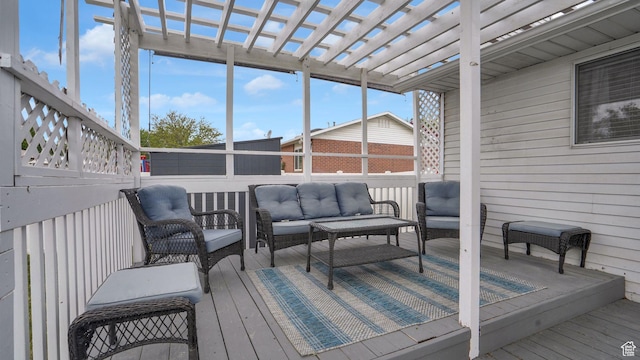 deck with an outdoor hangout area and a pergola