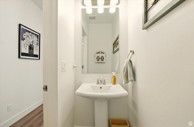 1412 W 1920 S, Logan, UT 84321 - bathroom featuring wood finished floors and baseboards
