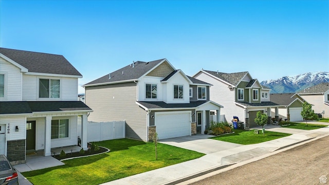 1412 W 1920 S, Logan, UT 84321 - view of front of house with driveway, a garage, a mountain view, and a residential view