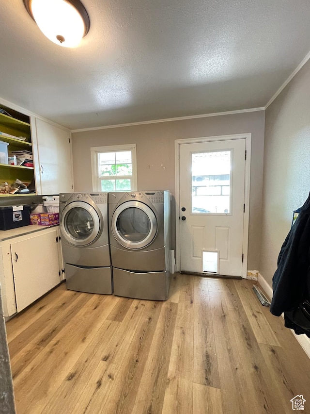 578 S 1500 W, Vernal, UT 84078 - laundry area featuring cabinet space, separate washer and dryer, light wood-type flooring, ornamental molding, and a textured ceiling