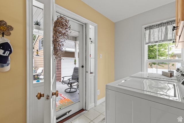 312 E 1st S, Preston, ID 83263 - washroom with washer and clothes dryer, light tile patterned flooring, and baseboards