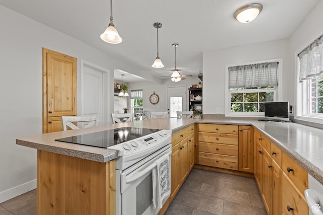 312 E 1st S, Preston, ID 83263 - kitchen featuring white range with electric cooktop, decorative light fixtures, a ceiling fan, a peninsula, and light brown cabinets