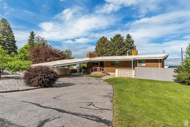 1485 E 1850 N, Provo, UT 84604 - ranch-style home featuring a chimney, asphalt driveway, an attached carport, and brick siding