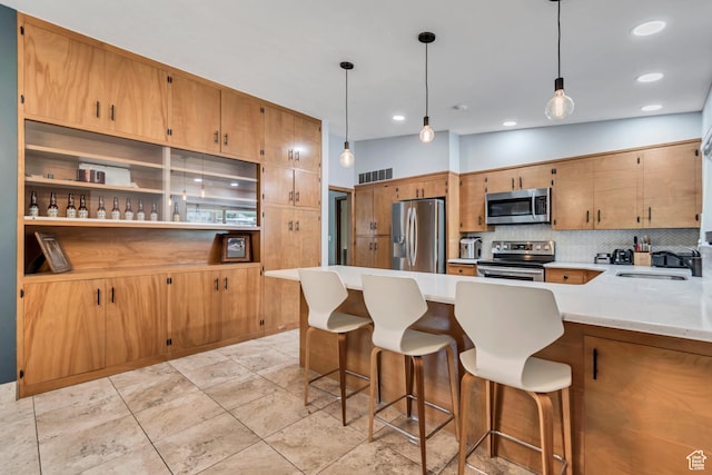 1485 E 1850 N, Provo, UT 84604 - kitchen with appliances with stainless steel finishes, a sink, light countertops, backsplash, and a peninsula
