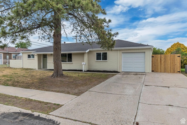 4098 W 5580 S, Salt Lake City, UT 84118 - ranch-style house featuring an attached garage, concrete driveway, and brick siding
