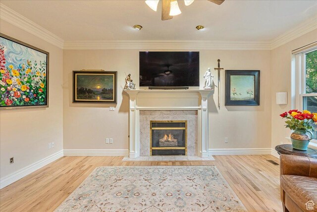14 N 1025 E, Lindon, UT 84042 - living area with wood finished floors, baseboards, a premium fireplace, crown molding, and ceiling fan
