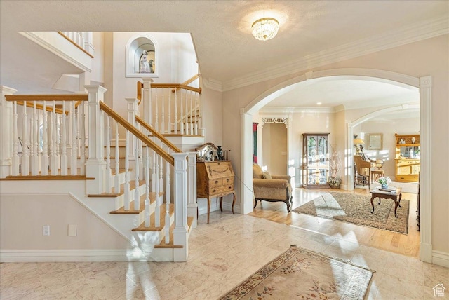 14 N 1025 E, Lindon, UT 84042 - foyer with arched walkways, baseboards, crown molding, stairway, and marble finish floors