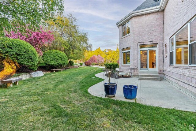 14 N 1025 E, Lindon, UT 84042 - view of grassy yard featuring a patio