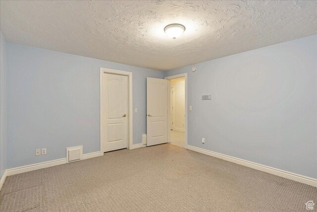 14 N 1025 E, Lindon, UT 84042 - spare room featuring light colored carpet, baseboards, and a textured ceiling