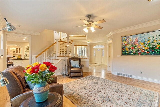 14 N 1025 E, Lindon, UT 84042 - living area with ornamental molding, stairway, ceiling fan, wood finished floors, and baseboards