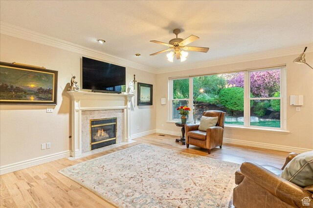 14 N 1025 E, Lindon, UT 84042 - living room with wood finished floors, ceiling fan, crown molding, a high end fireplace, and baseboards