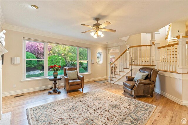 14 N 1025 E, Lindon, UT 84042 - sitting room with stairs, wood finished floors, a ceiling fan, and crown molding