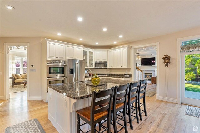 14 N 1025 E, Lindon, UT 84042 - kitchen with appliances with stainless steel finishes, light wood finished floors, baseboards, recessed lighting, and a sink