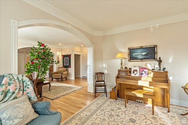 14 N 1025 E, Lindon, UT 84042 - sitting room with arched walkways, wood finished floors, crown molding, and baseboards