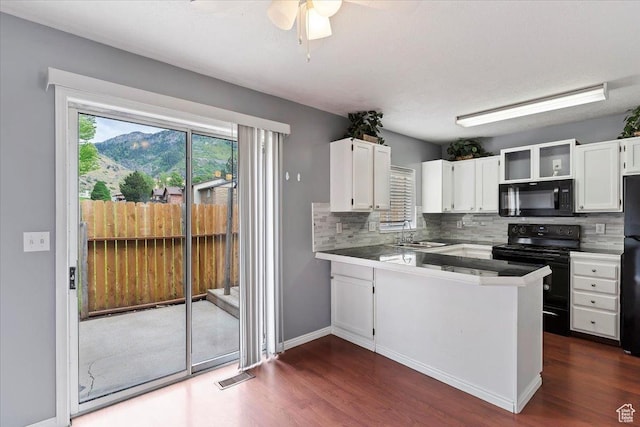 1464 S 1650 E, Ogden, UT 84404 - kitchen featuring black appliances, white cabinets, a peninsula, a sink, and decorative backsplash