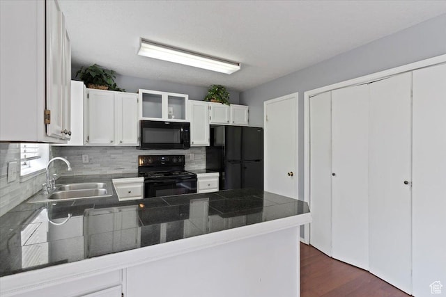 1464 S 1650 E, Ogden, UT 84404 - kitchen with black appliances, a peninsula, a sink, dark countertops, and backsplash