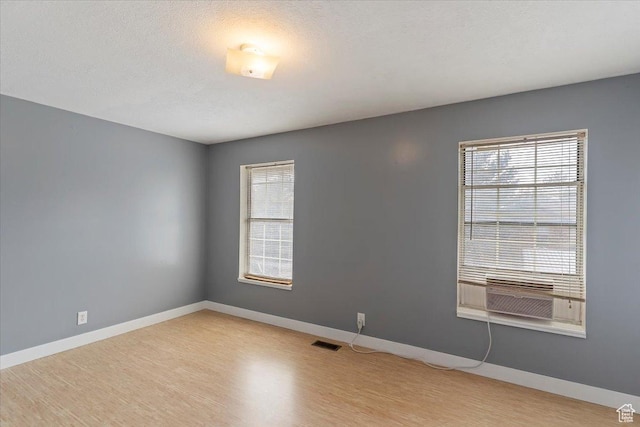 1464 S 1650 E, Ogden, UT 84404 - unfurnished room featuring light wood finished floors, baseboards, and cooling unit