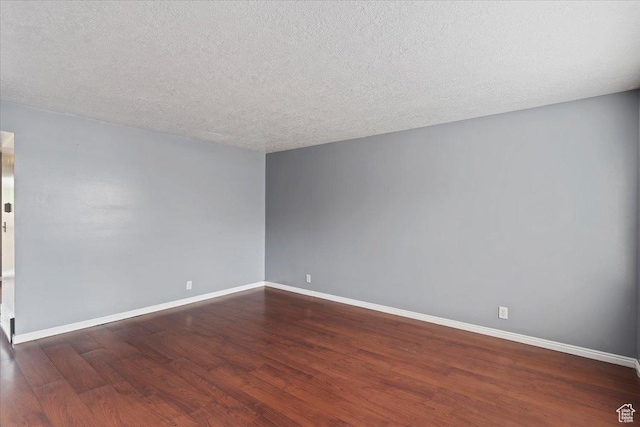 1464 S 1650 E, Ogden, UT 84404 - empty room featuring wood finished floors, baseboards, and a textured ceiling