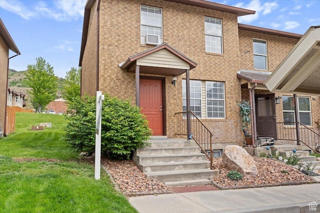 1464 S 1650 E, Ogden, UT 84404 - view of property with a front lawn and brick siding