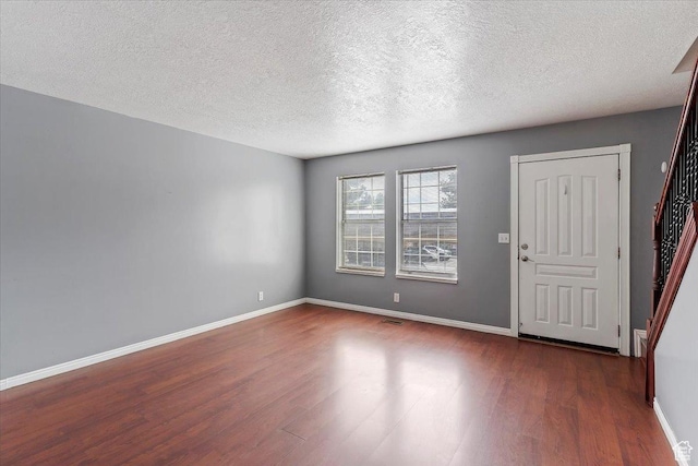 1464 S 1650 E, Ogden, UT 84404 - entrance foyer featuring dark wood-style floors, a textured ceiling, and baseboards