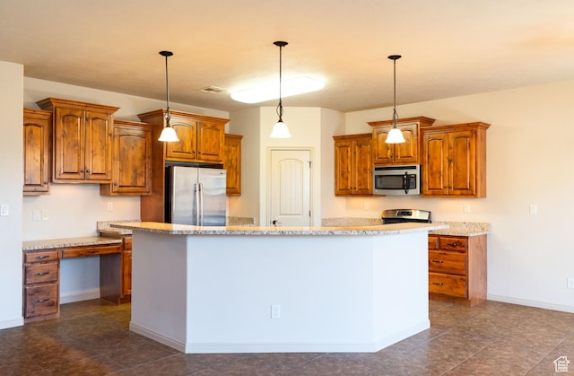2710 W 410 N, Hurricane, UT 84737 - kitchen with stainless steel appliances, brown cabinets, a center island, hanging light fixtures, and baseboards